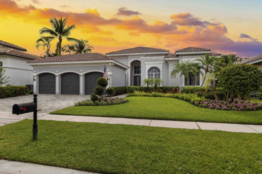 south florida home with tile rooftop with sunset in background